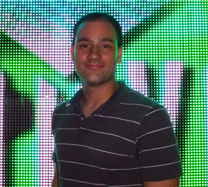 Product Engineer Anthony Chiappone proudly stands in front of MVP panels.